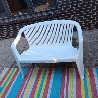 2 PLASTIC BENCHES AND 2 ADIRONDACK CHAIRS PLUS AN OUTDOOR RUG