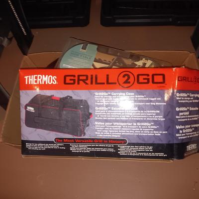 LIKE NEW THERMOS GRILL TO GO PLUS SEVERAL COOLERS AND A FOLDING CHAIR