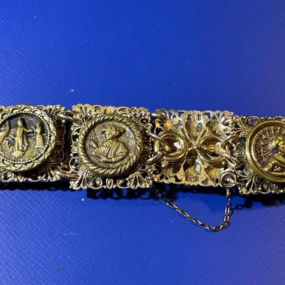 Vintage/Antique German Brass 7" Figural Bracelet in Good Preowned Condition.