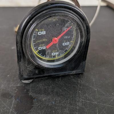 Ford Model A Oval Speedometer, Deluxe Clock, and Varied Gauges