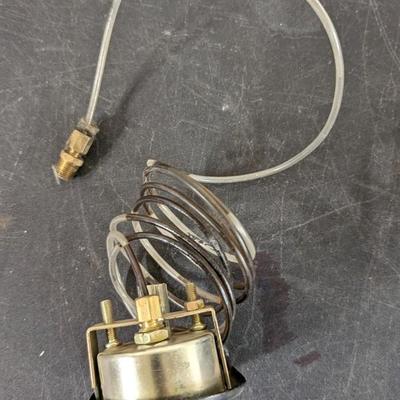 Ford Model A Oval Speedometer, Deluxe Clock, and Varied Gauges