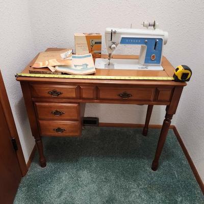 Vintage 1960's Singer Sewing Machine 604e with a maple cabinet/ accessories