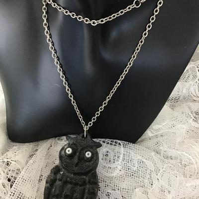Black wooden owl charm on silver tone necklace