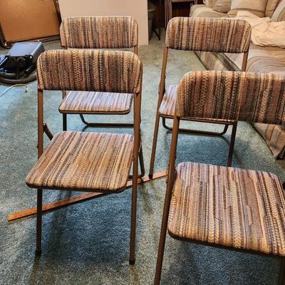 four Cosco folding chairs with vintage cloth seats and folding table