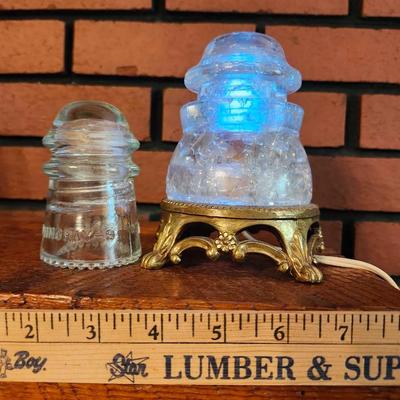 Glass phone line insulator that had been turned into a light plus small insulator