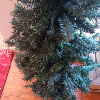 LITE EVERGREEN TREE IN A POT, 3 THROW RUGS, ORNAMENTS, STOCKING STUFFERS, ETC