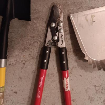SHOVELS, LOPERS AND A LARGE METAL DUST PAN