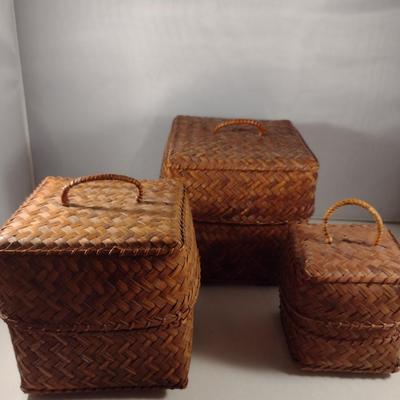 Three Graduated Woven Baskets with Lids