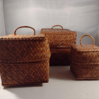 Three Graduated Woven Baskets with Lids