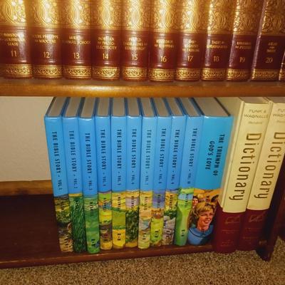 SMALL BOOKCASE FILLED WITH ENCYCLOPEDIAS