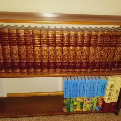 SMALL BOOKCASE FILLED WITH ENCYCLOPEDIAS