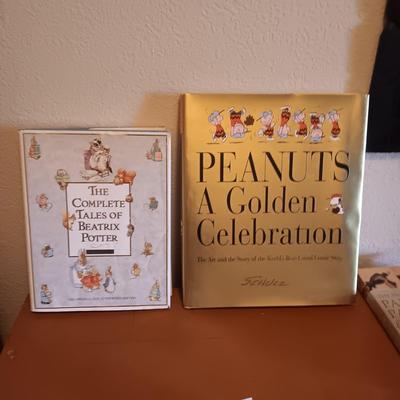 SMALL BOOK CASE FILLED WITH A VARIETY OF BOOKS