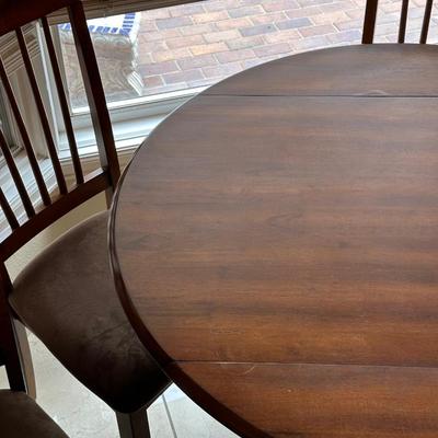ROUND DRUM DROP LEAF TABLE WITH 4 SEAT CUSHIONED CHAIRS