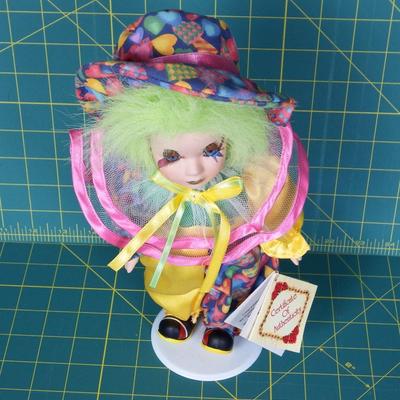 Collectible Fine Bisque Porcelain Clown on stand