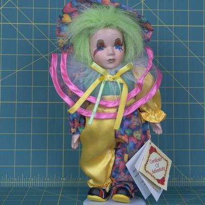Collectible Fine Bisque Porcelain Clown on stand