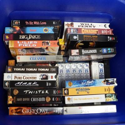 Container of VHS Movies & Exercise Tapes