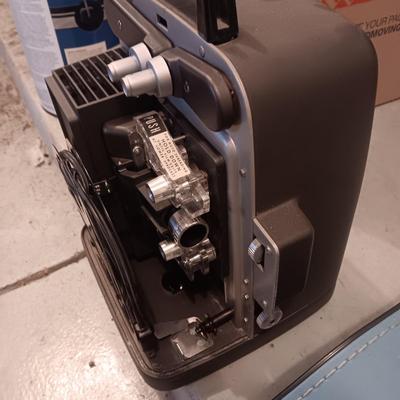 BELL & HOWELL MOVIE PROJECTER AND A CALCULATOR