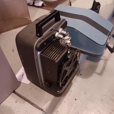 BELL & HOWELL MOVIE PROJECTER AND A CALCULATOR