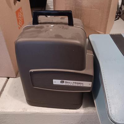 BELL & HOWELL MOVIE PROJECTER AND A CALCULATOR