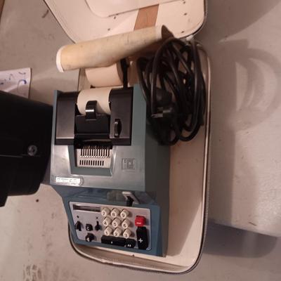 BELL & HOWELL MOVIE PROJECTER AND A CALCULATOR