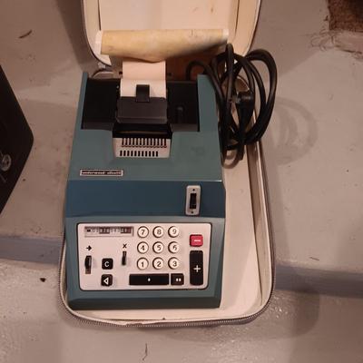 BELL & HOWELL MOVIE PROJECTER AND A CALCULATOR