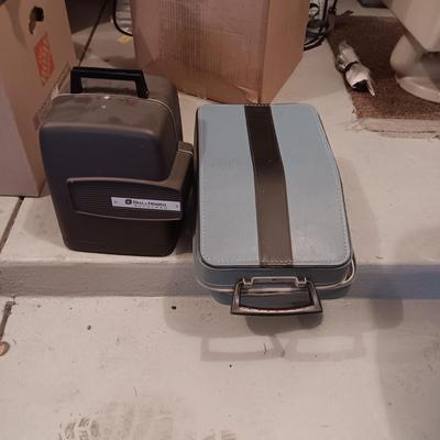 BELL & HOWELL MOVIE PROJECTER AND A CALCULATOR