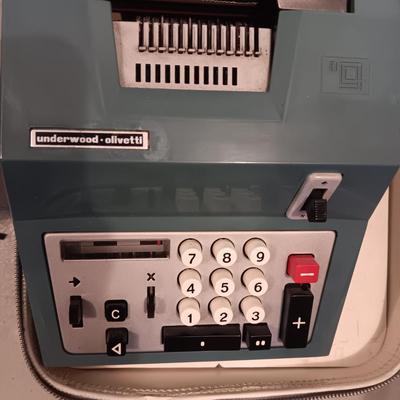 BELL & HOWELL MOVIE PROJECTER AND A CALCULATOR