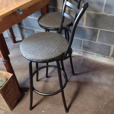 Three Swiveling Bar Stools with Upholstered Seats