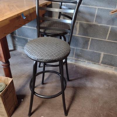 Three Swiveling Bar Stools with Upholstered Seats