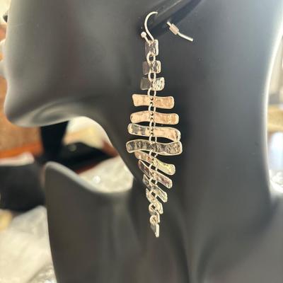 Super cute silver toned statement earrings