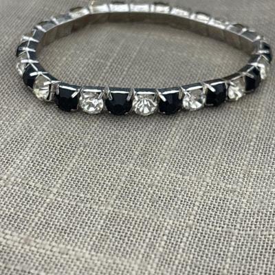 Black and silver rhinestones on silver tone charm stretchy bracelet