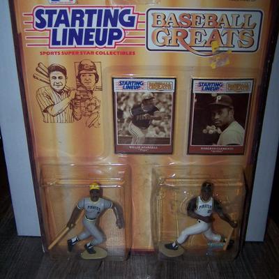 LOT 128 NEW IN PACKAGE STARTING LINE-UP BASEBALL GREATS ROBERTO CLEMENTE & WILLIE STARGEL