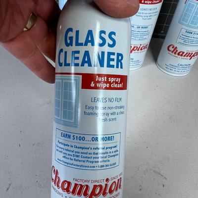(3) Full Bottles and 1 Partial  Champion Glass Cleaner 