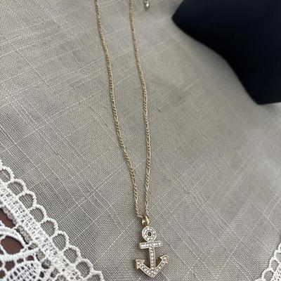 Gold tone silver rhinestone anchor necklace