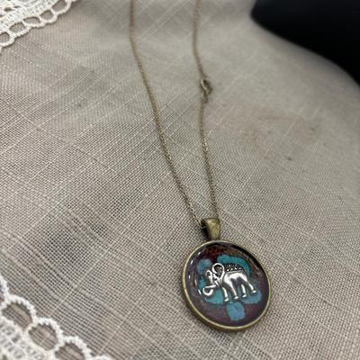 Gold toned necklace with elephant pendant