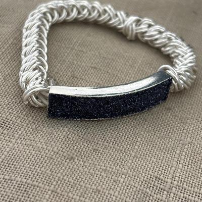 Marked silver toned adjustable bracelet with sparkle front