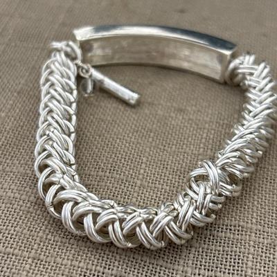 Marked silver toned adjustable bracelet with sparkle front