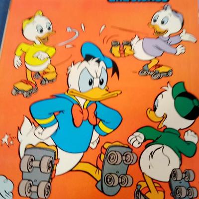 LOT 131 THREE WALT DISNEY COMIC BOOKS