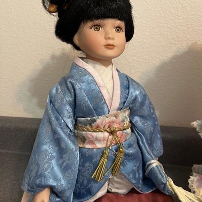 B31- Precious Moments & Geisha doll with hats