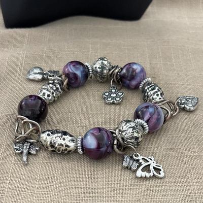 Silver tone purple beaded charm bracelet