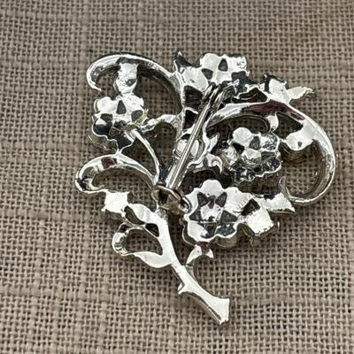 Silver tone rhinestone flower brooch