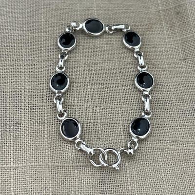 Silver tone and black charm bracelet