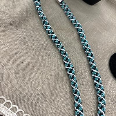 White, blue, and black beaded necklace