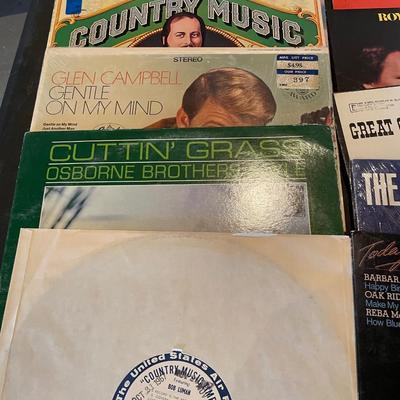 AN ASSORTMENT OF MUSIC ON VINYL RECORDS