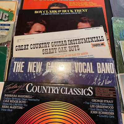 AN ASSORTMENT OF MUSIC ON VINYL RECORDS
