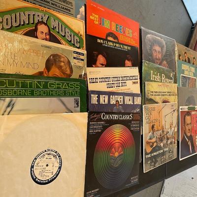 AN ASSORTMENT OF MUSIC ON VINYL RECORDS