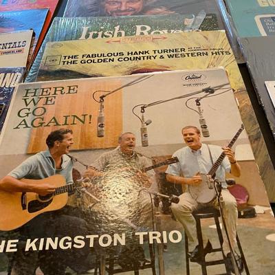 AN ASSORTMENT OF MUSIC ON VINYL RECORDS