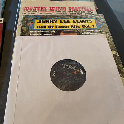 AN ASSORTMENT OF MUSIC ON VINYL RECORDS