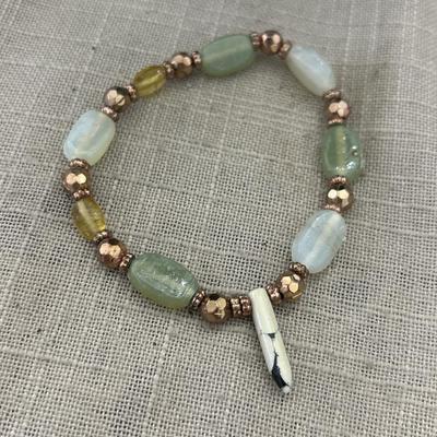 Gold tone green and white beaded bracelet