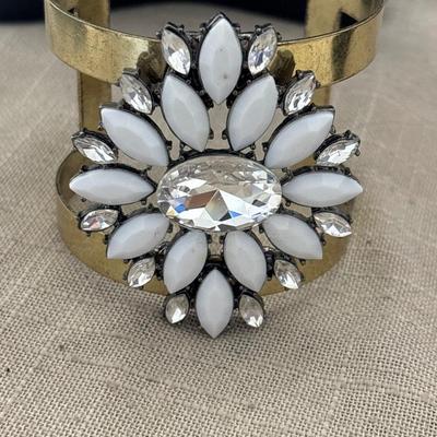 Gold tone cuff white gem flower bracelet